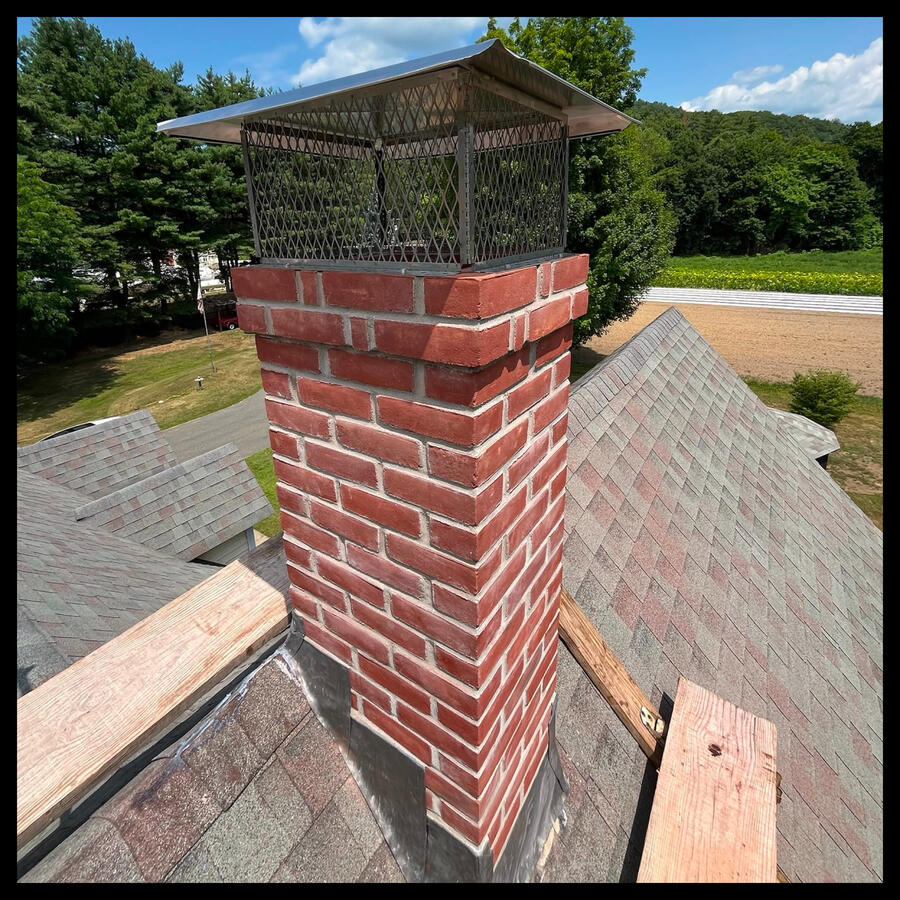 Chimney Rebuild from the Roof with Custom Stainless Steel Rain Cap